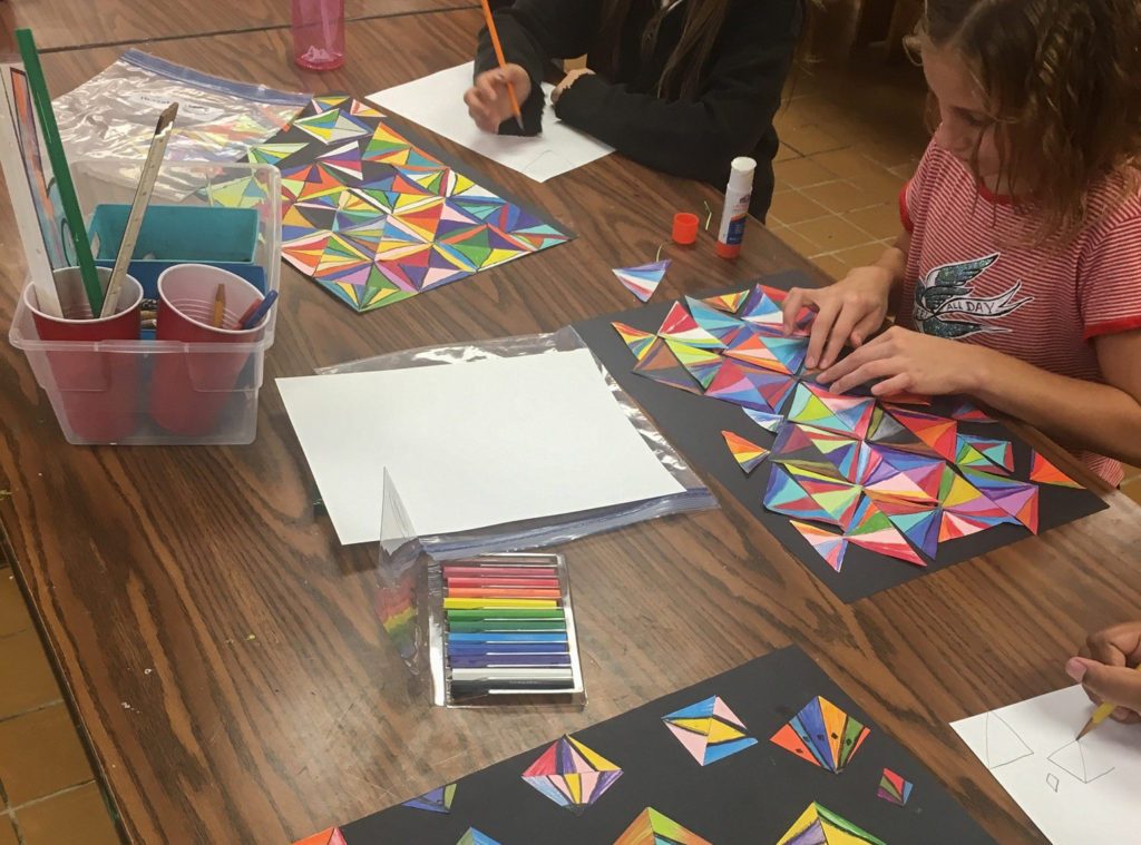 Photo illustrating a child's artwork being celebrated as an artistic achievement