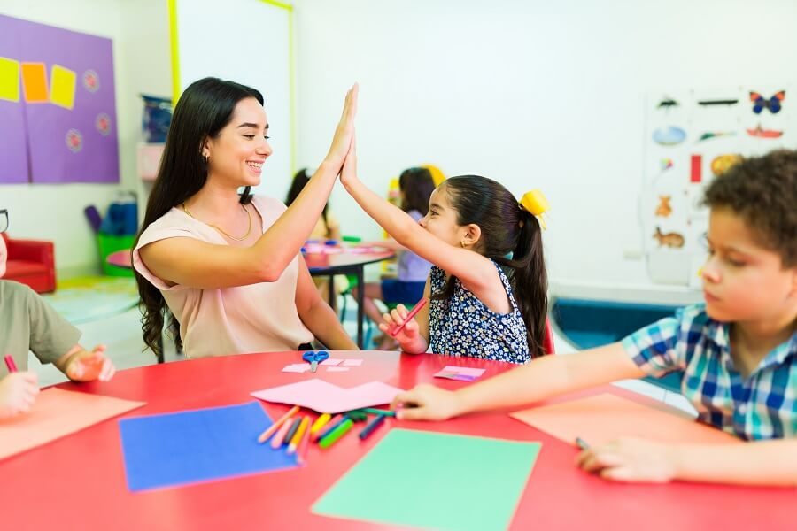 A child engaged in a hands-on art activity, illustrating visual learning and observation