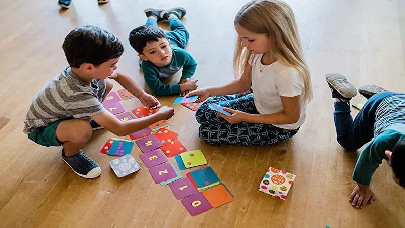 Children of different ages engaged in art activities suited to their stage of development