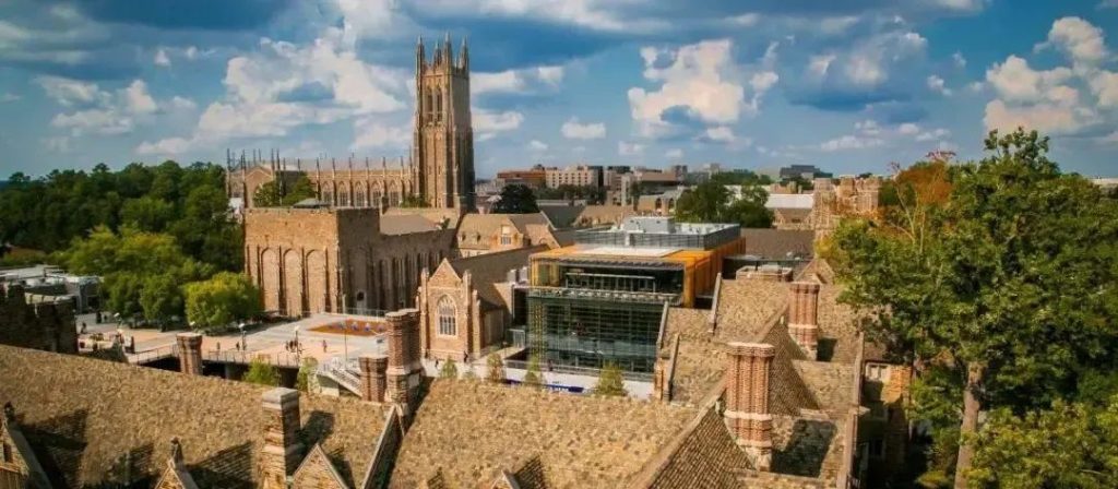 Aerial campus view with a Gothic chapel tower, representing one of the Ivy Plus universities