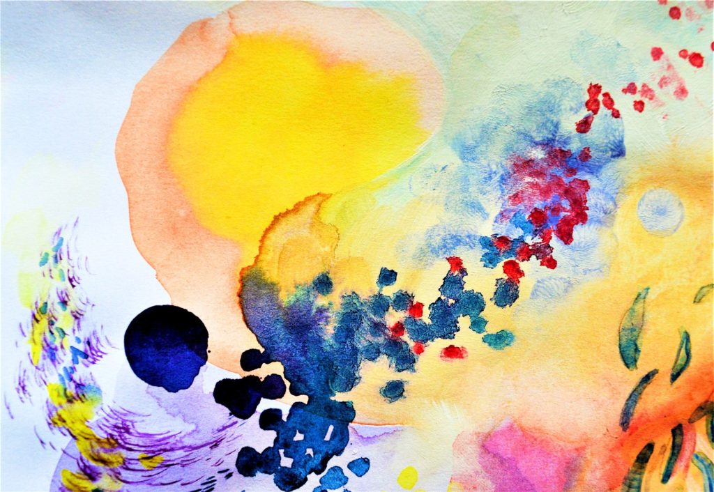 Colorful abstract watercolor painting with expressive splashes of blue, orange, yellow, and red