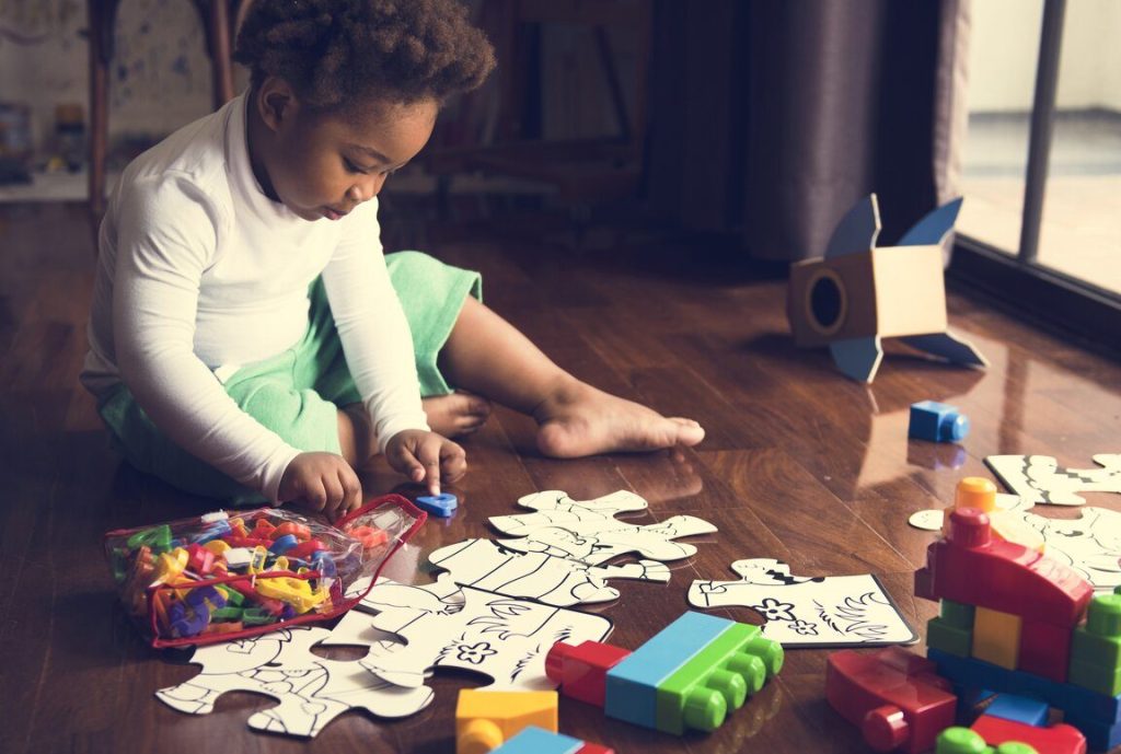 Child engaged in a creative activity that involves planning and decision-making