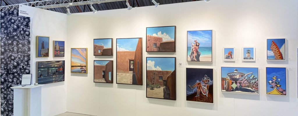 Gallery wall displaying an exhibition of framed artworks