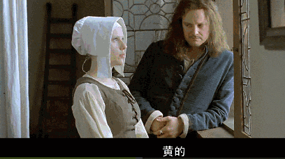 Film still from Girl with a Pearl Earring depicting the moment Griet wears the pearl earring