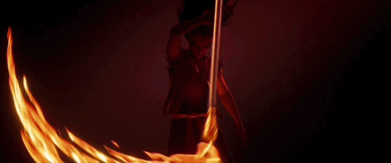 Animated shot of Nezha swinging a blazing weapon that traces a fiery arc through the air