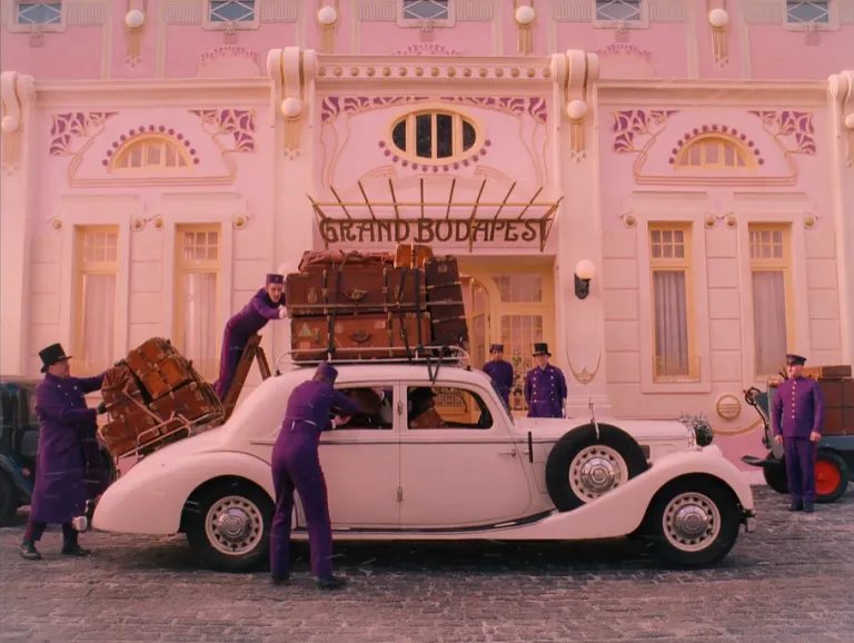Symmetrically framed still from The Grand Budapest Hotel showcasing Wes Anderson's meticulous compositions