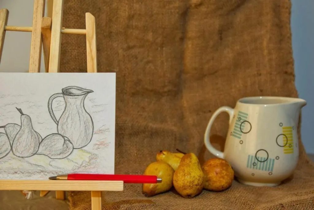 A realistic pencil sketch of a jug and pears copied from a still-life setup