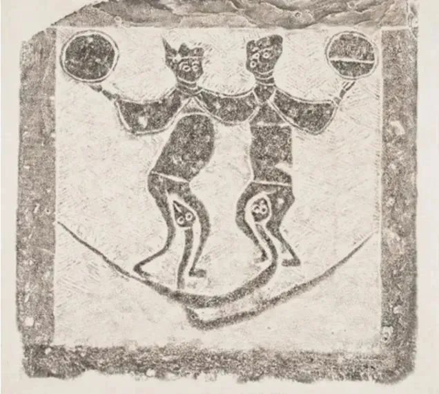 Museum artifact depicting the mythological figures Fuxi and Nuwa with serpent bodies