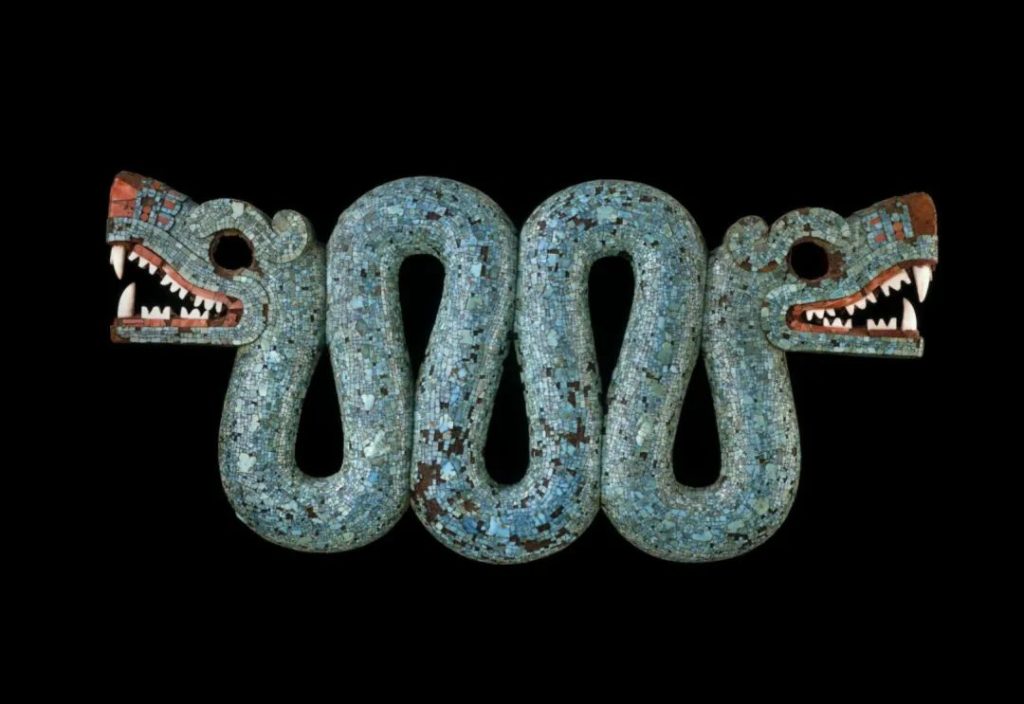 Aztec double-headed serpent ornament covered in turquoise mosaic, a ceremonial artifact associated with feathered-serpent deities such as Quetzalcoatl