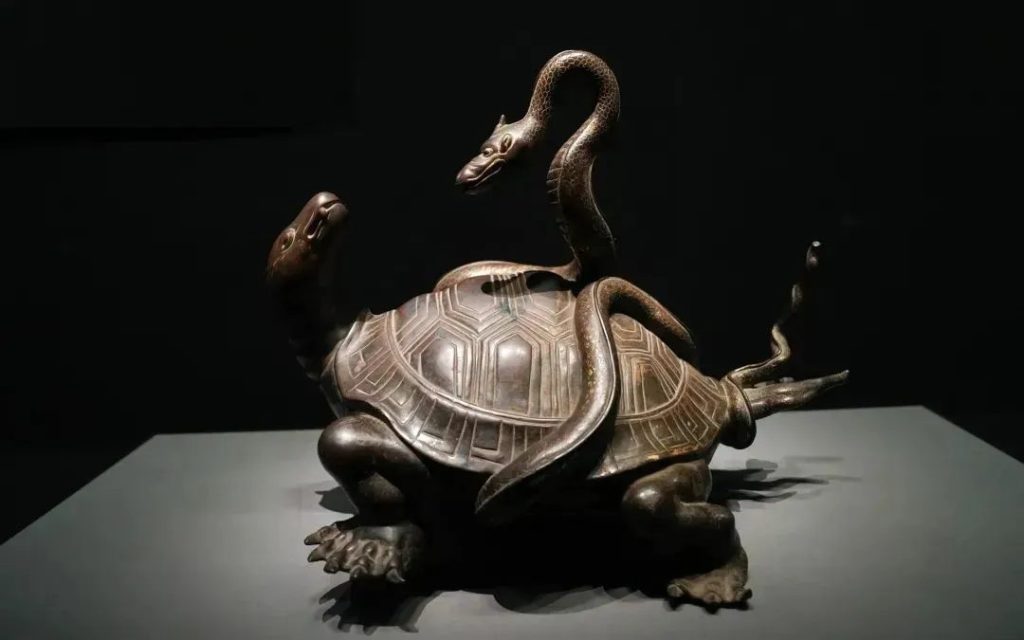 Ancient artifact depicting Xuanwu, shown as a turtle entwined with a snake