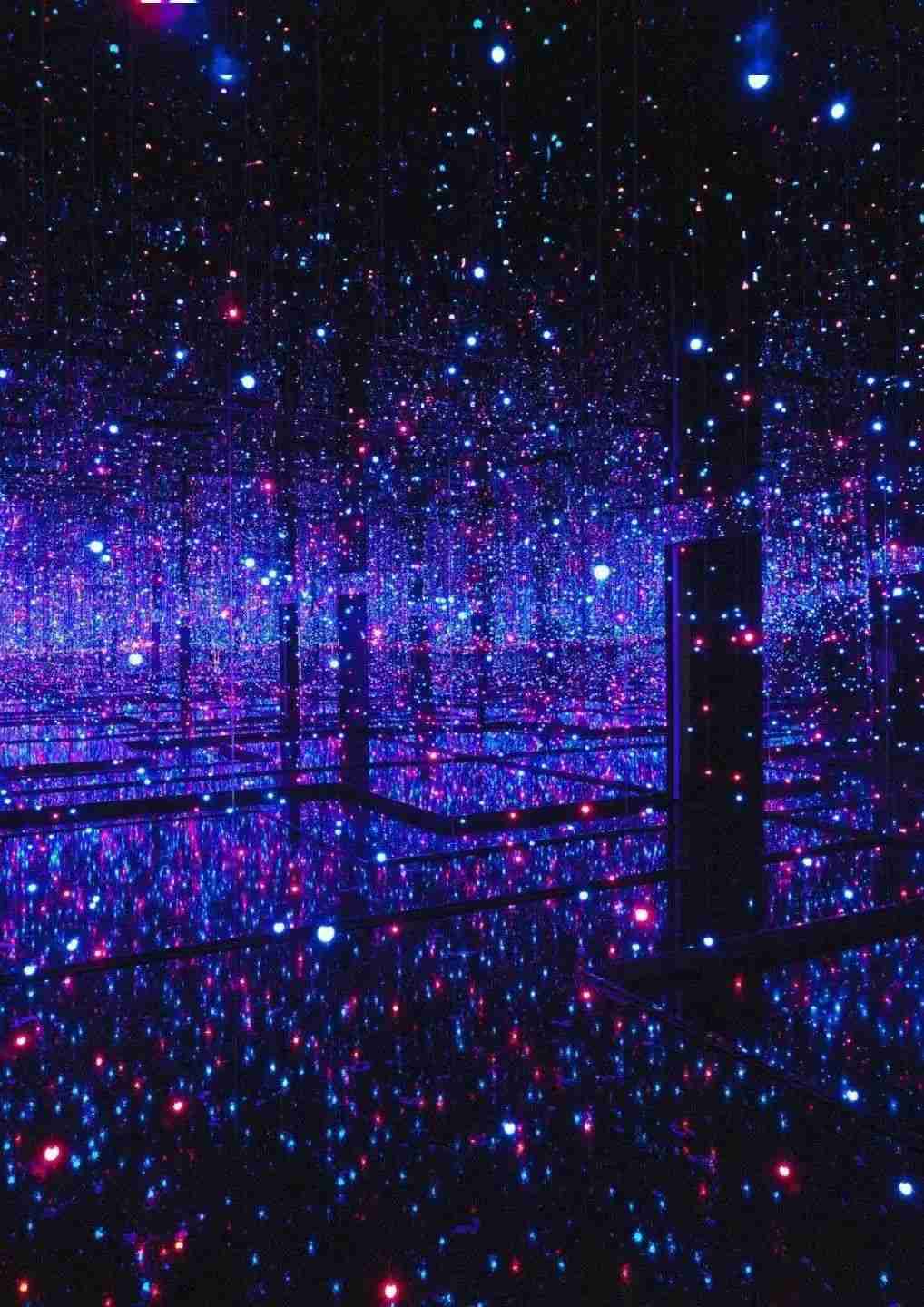 Yayoi Kusama's Infinity Mirror Room installation filled with sparkling lights