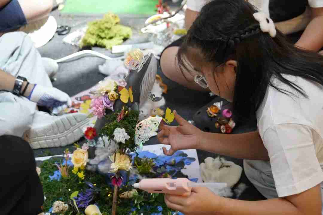Photo of winners working together on a collaborative art piece