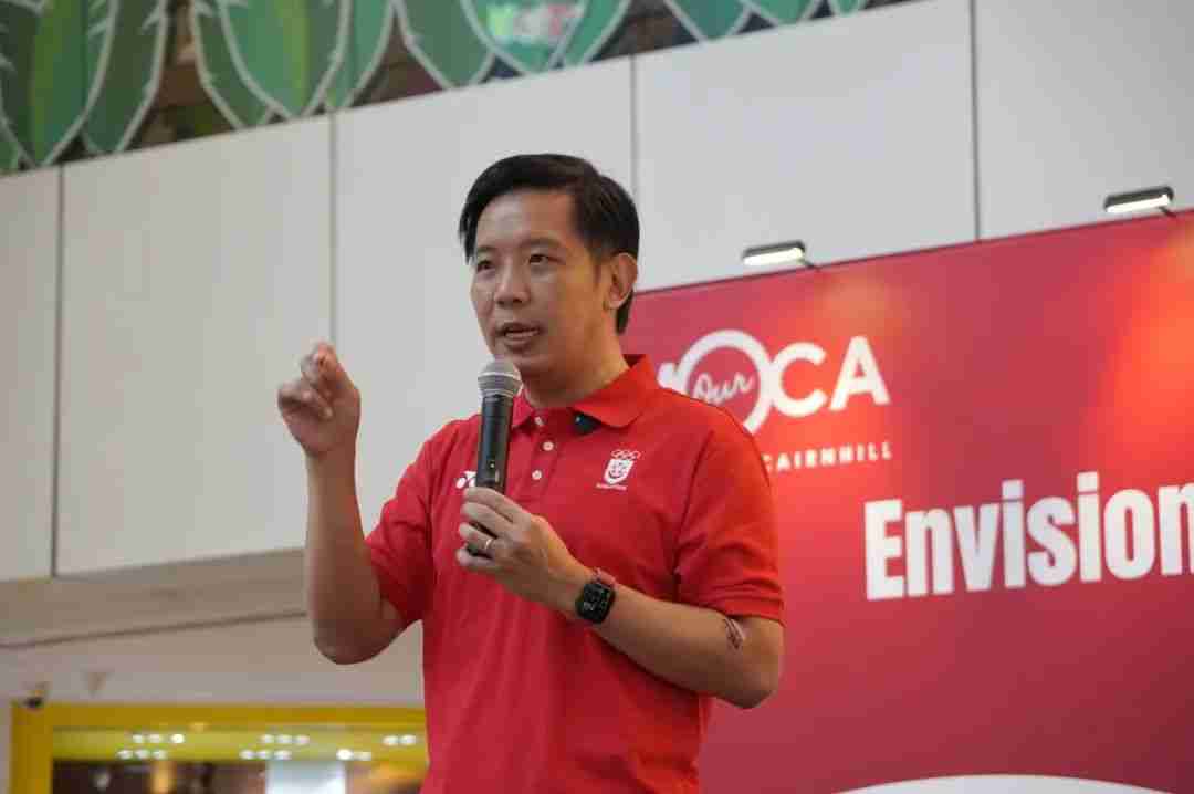 Mr Alvin Tan speaking on stage in front of the MOCA event backdrop at the Our Future Canvas event