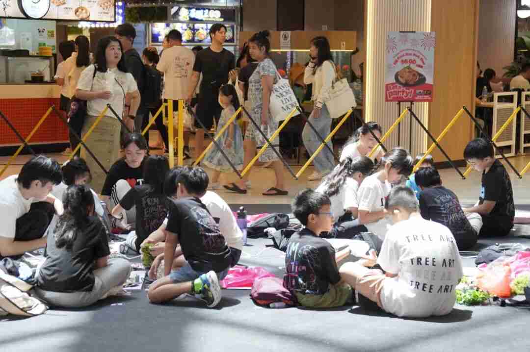 Photo of winners collaborating on a new art installation for "The Living Bond"