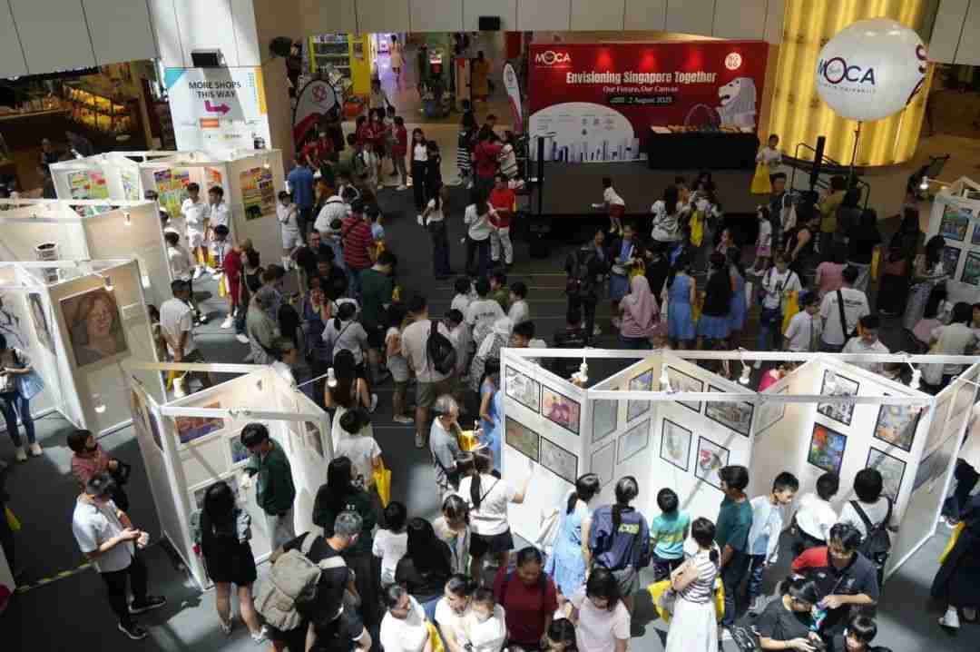 Visitors admiring the exhibited artworks at the United Square atrium display