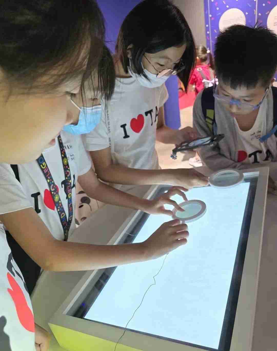Child creating art with paint and brushes