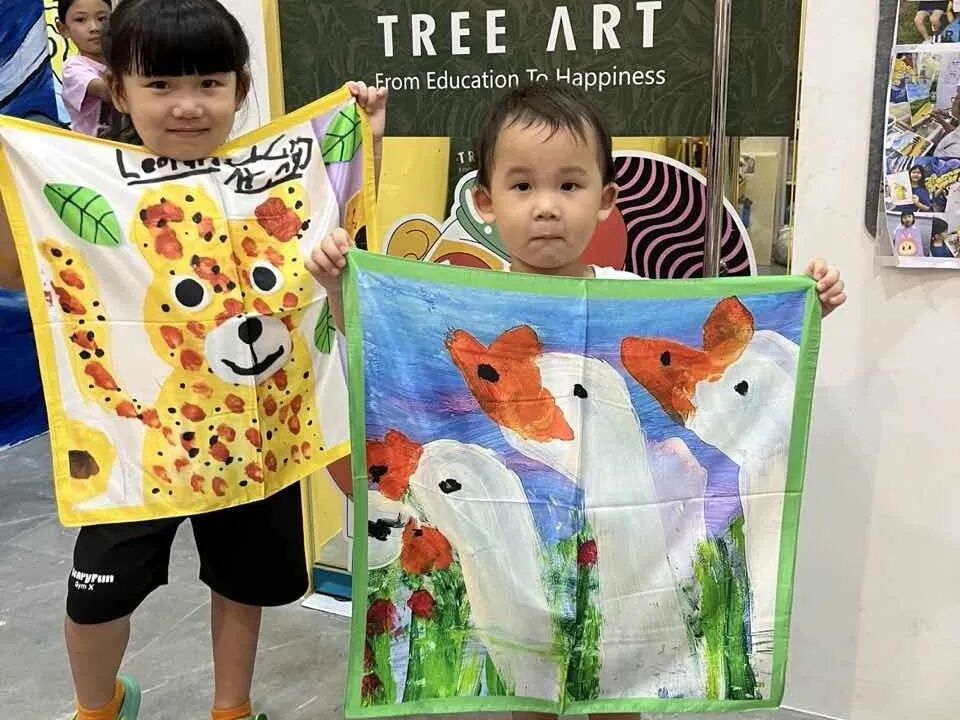 TREE ART students showing off their imaginative scarf designs