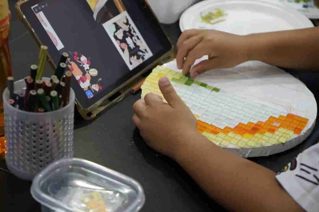 Children bonding over a shared artwork, connecting through their common color preferences