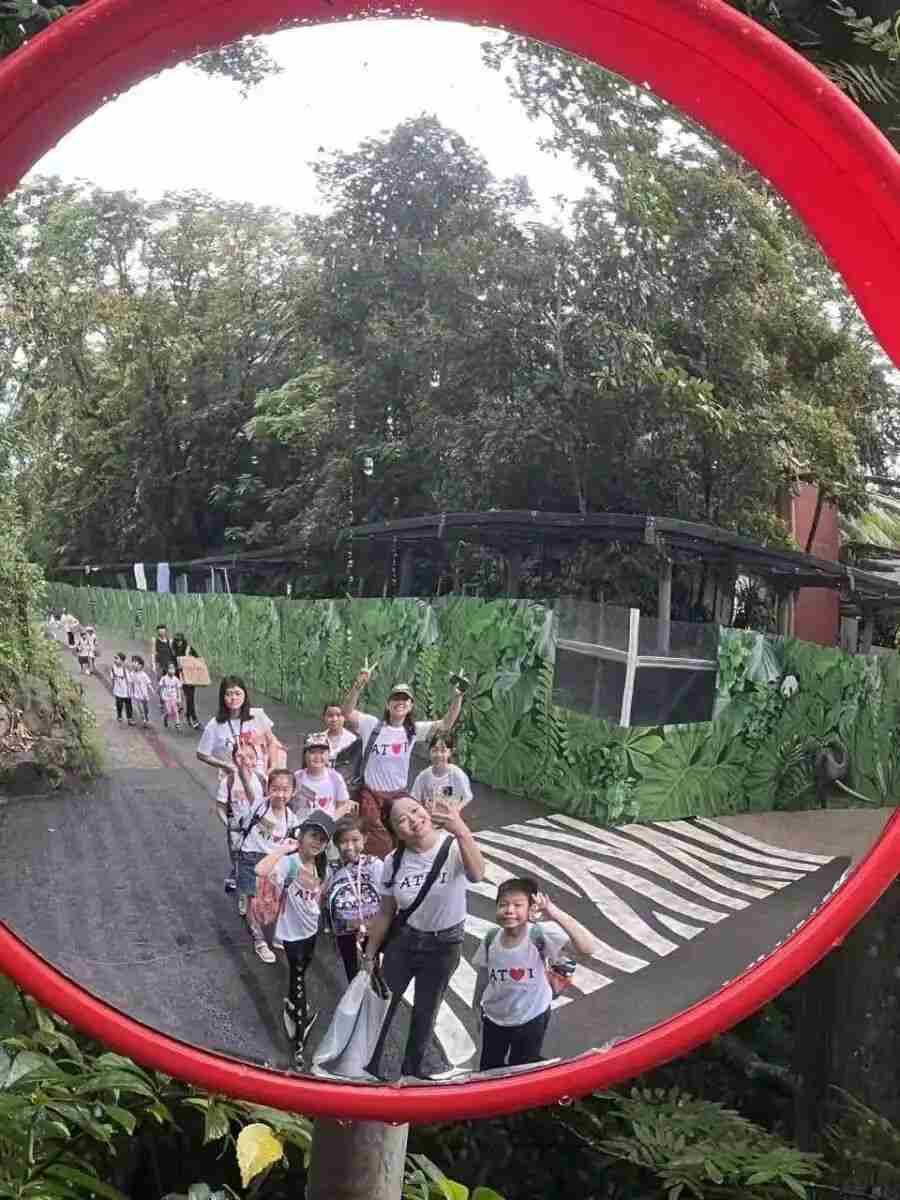 A child creating art inspired directly by the surrounding landscape