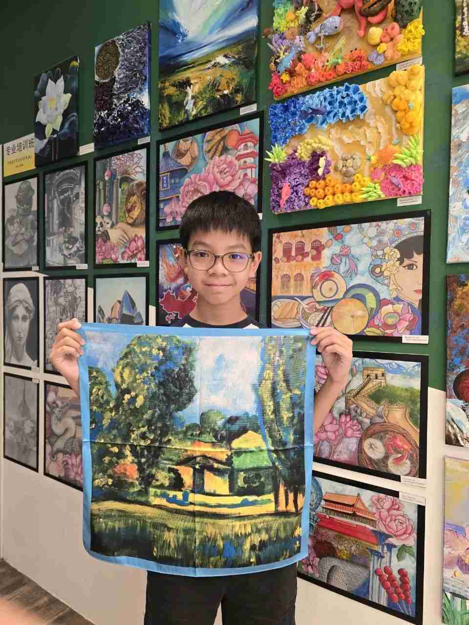 Young artist proudly showing their silk scarf design