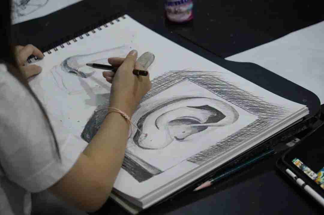 A child painting an imaginative, colourful scene during a TreeArt class