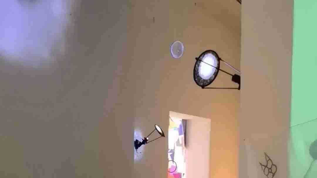 Interactive light installation with glowing orb and disc-shaped lamps mounted on gallery walls, part of the Future Perception Lab