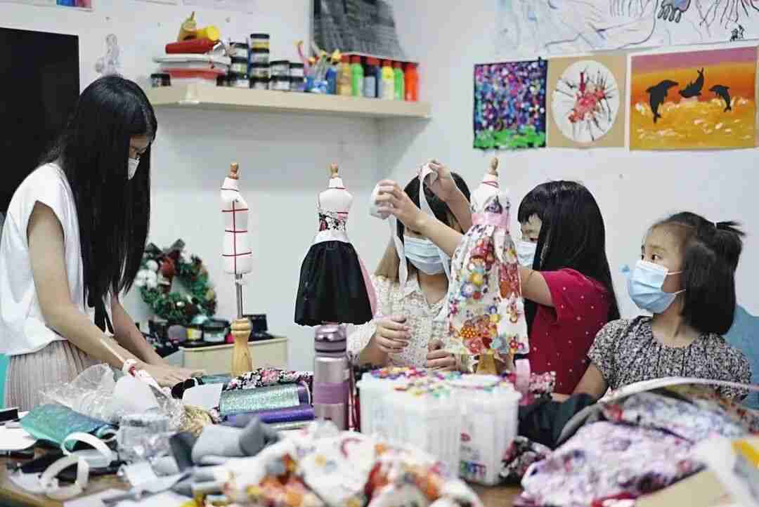 A TreeArt student working on a fashion design project in class