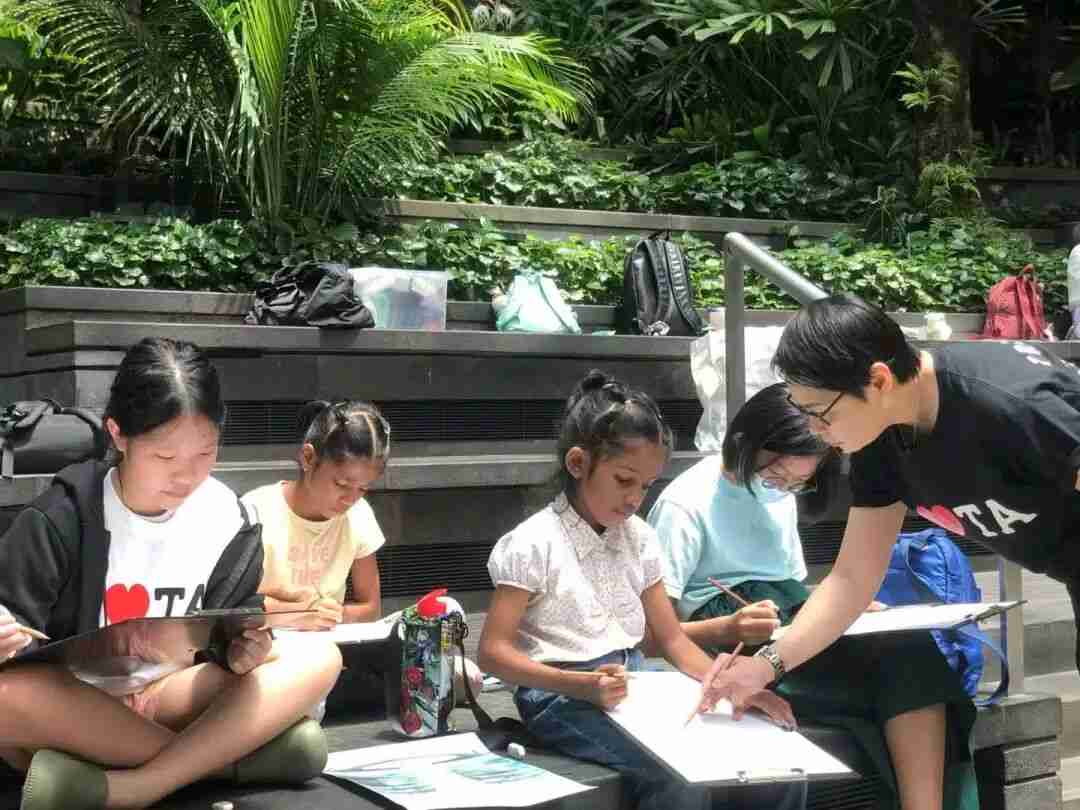 A child composing a sketch, learning to capture light and shadow