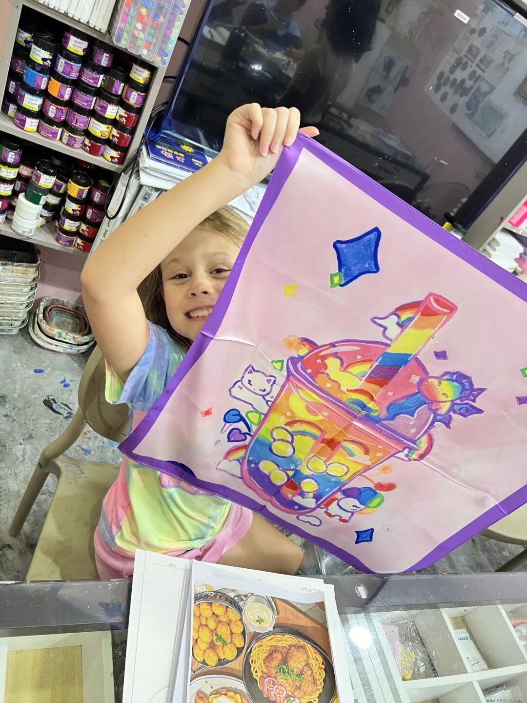 Child's scarf artwork proudly displayed at home