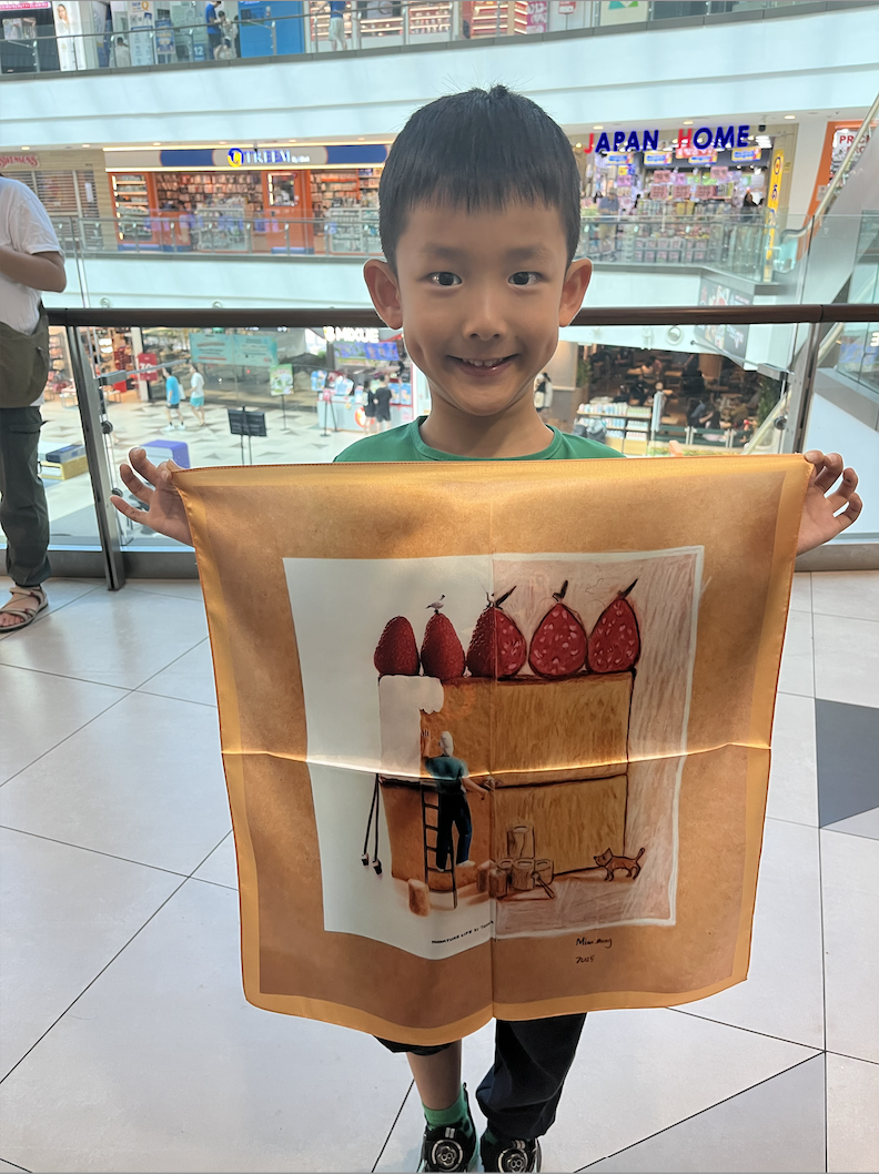 Silk scarf detail showing a child's imaginative pattern