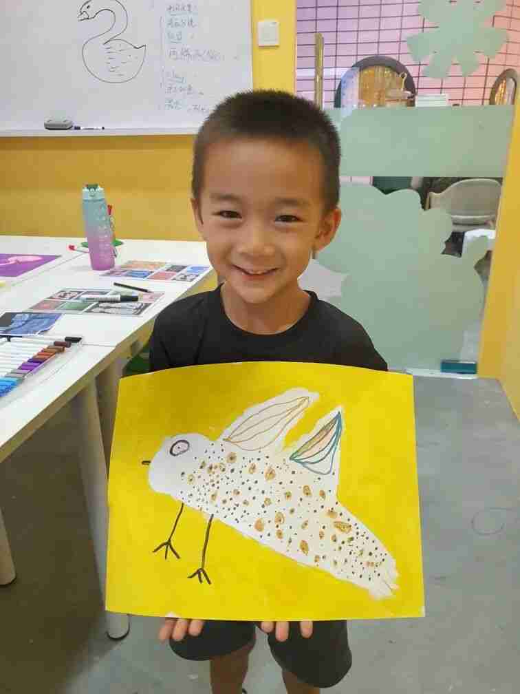 A TreeArt student focused on an art-making activity in class