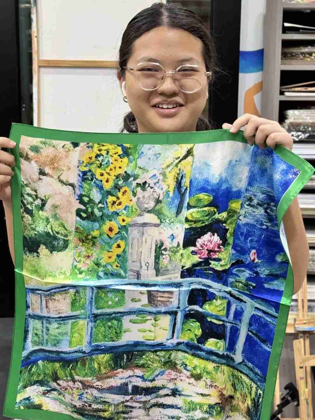 TREE ART student presenting their custom silk scarf design