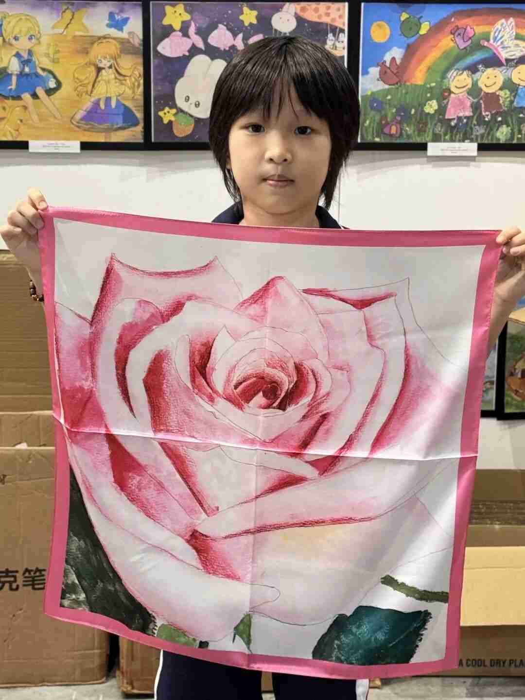TREE ART student showing off their original silk scarf artwork