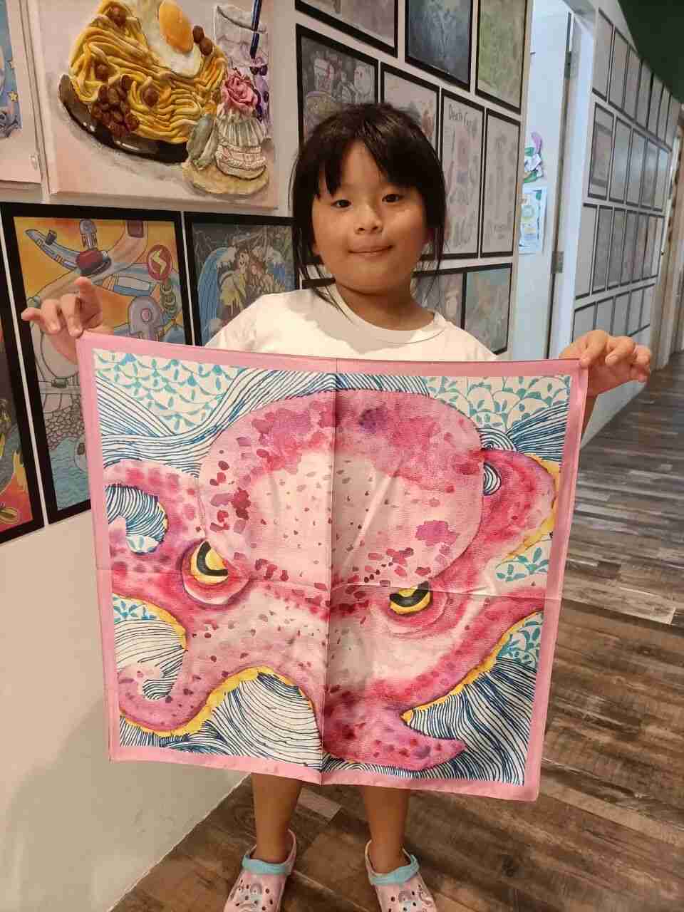 Mother wearing a silk scarf designed by her child