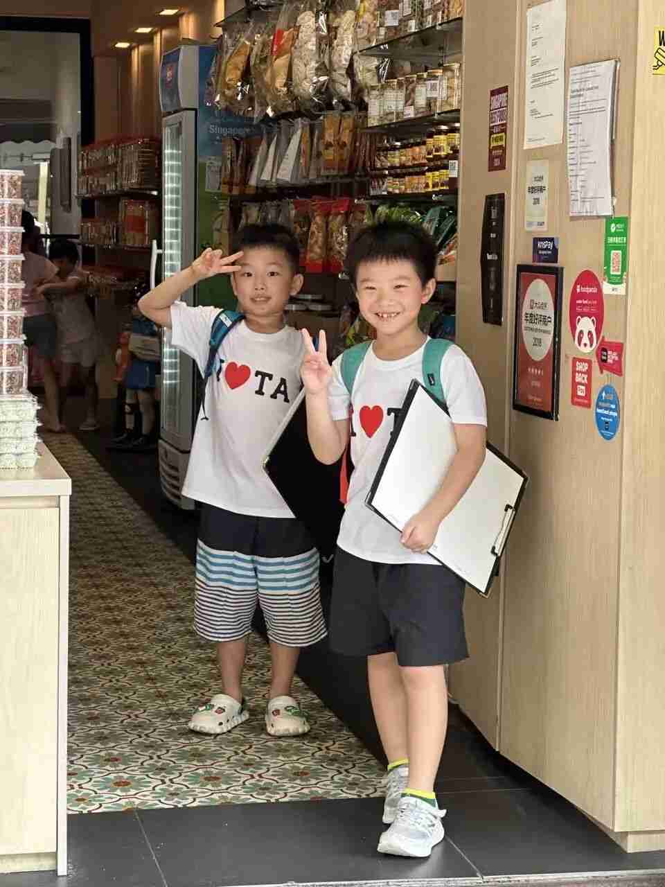 A child's outdoor sketching session set against Singapore's architecture and greenery