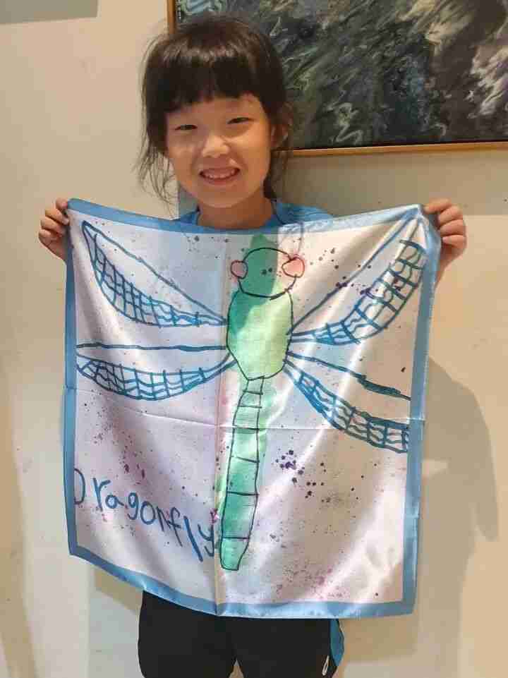 Silk scarf artwork framed at home to showcase a child's creativity