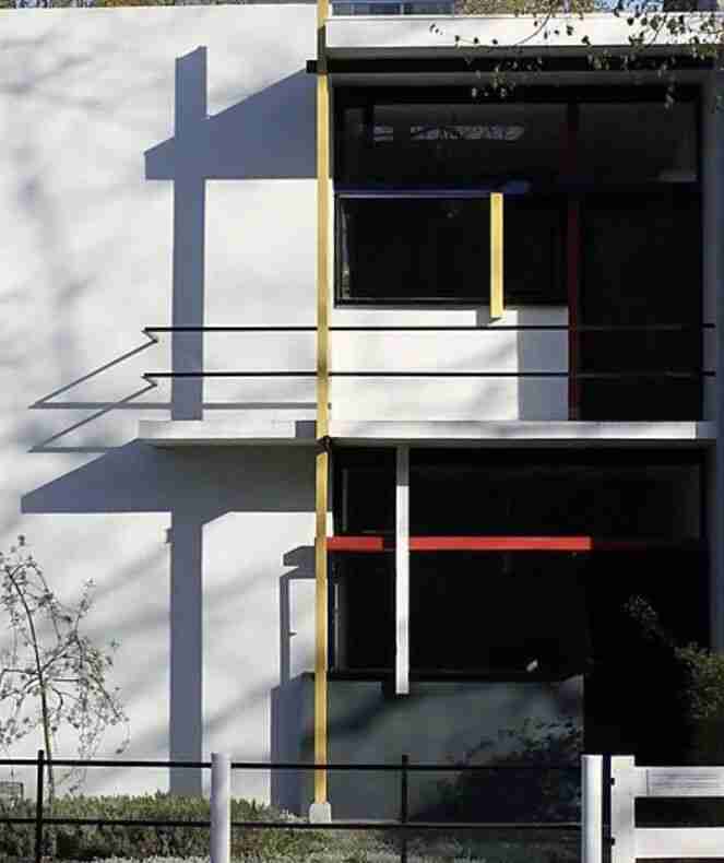A modernist building facade with primary-color accents echoing abstract art in architecture