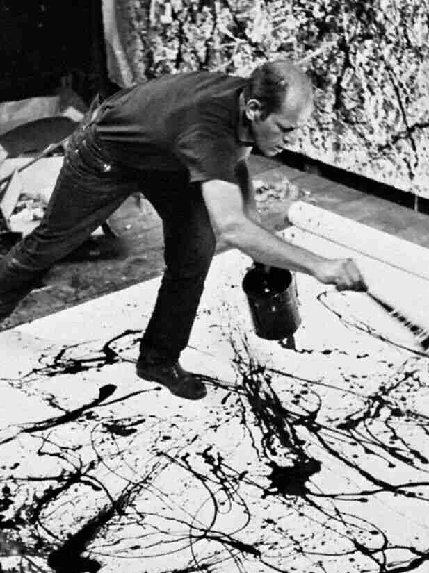 Jackson Pollock's drip-painting technique, with paint splattered across the canvas