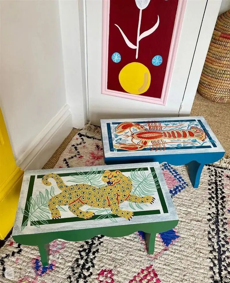 Two hand-painted footstools by Camilla Perkins, decorated with a lobster and a leopard motif