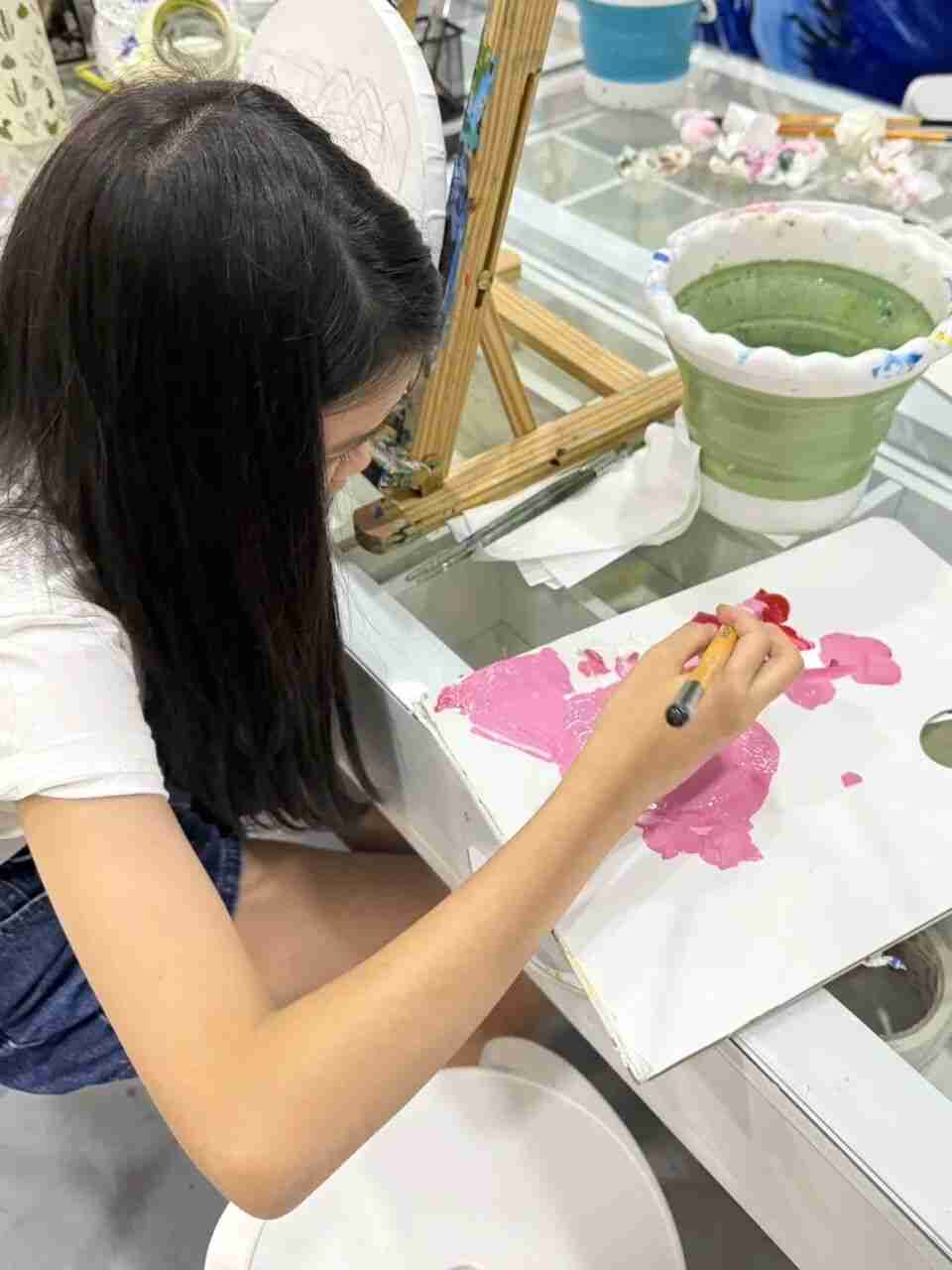 Another TreeArt student showcasing a piece of artwork
