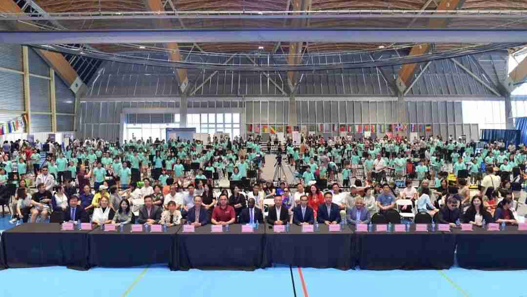 Hundreds of young painters and officials gathered in a hall decorated with national flags for the on-site painting competition round