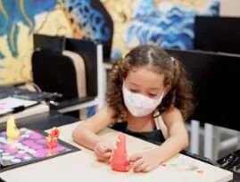 TreeArt student concentrating quietly, undistracted, on their artwork