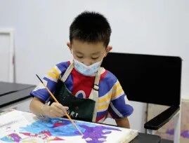 TreeArt student fine-tuning the finished artwork