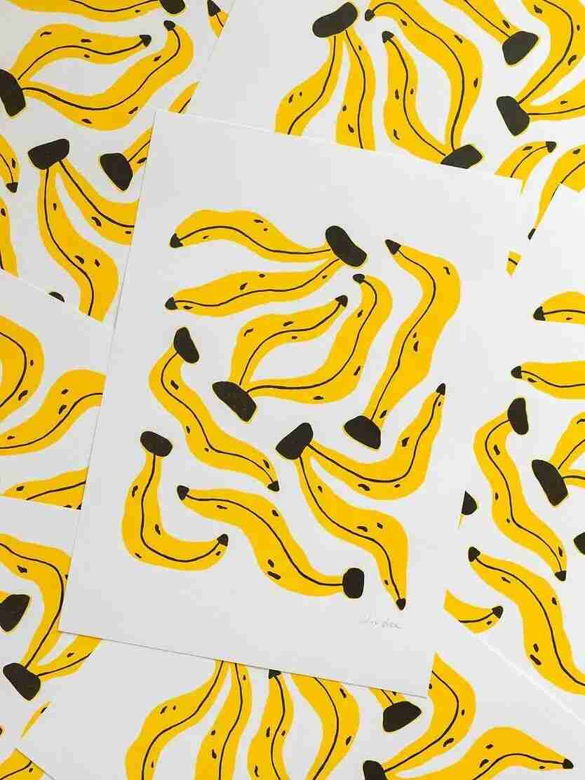 Scattered prints of Liv Lee's wobbly yellow banana illustration