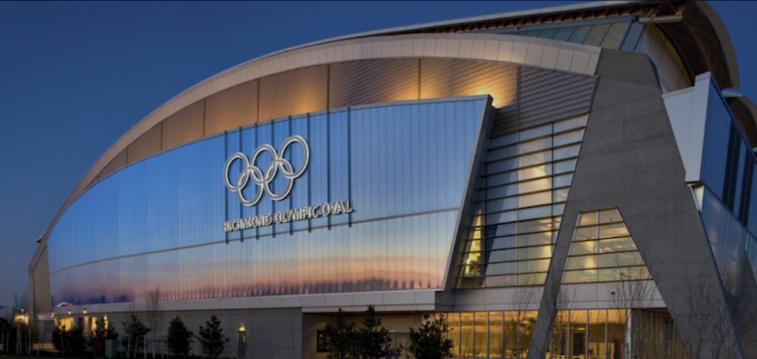 The Richmond Olympic Oval venue in Vancouver, Canada, lit up at dusk