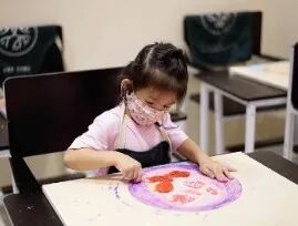 TreeArt student fully absorbed in a hands-on art project