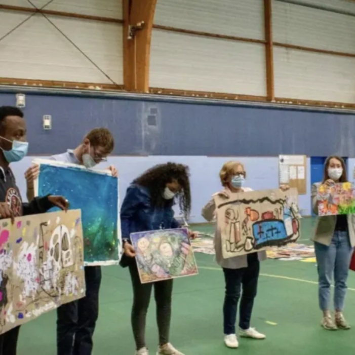 Jury members holding up shortlisted children's artworks for review