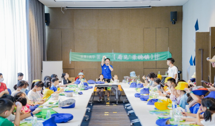 Children and an instructor at the Day 1 welcome gathering and opening ceremony in Jingdezhen