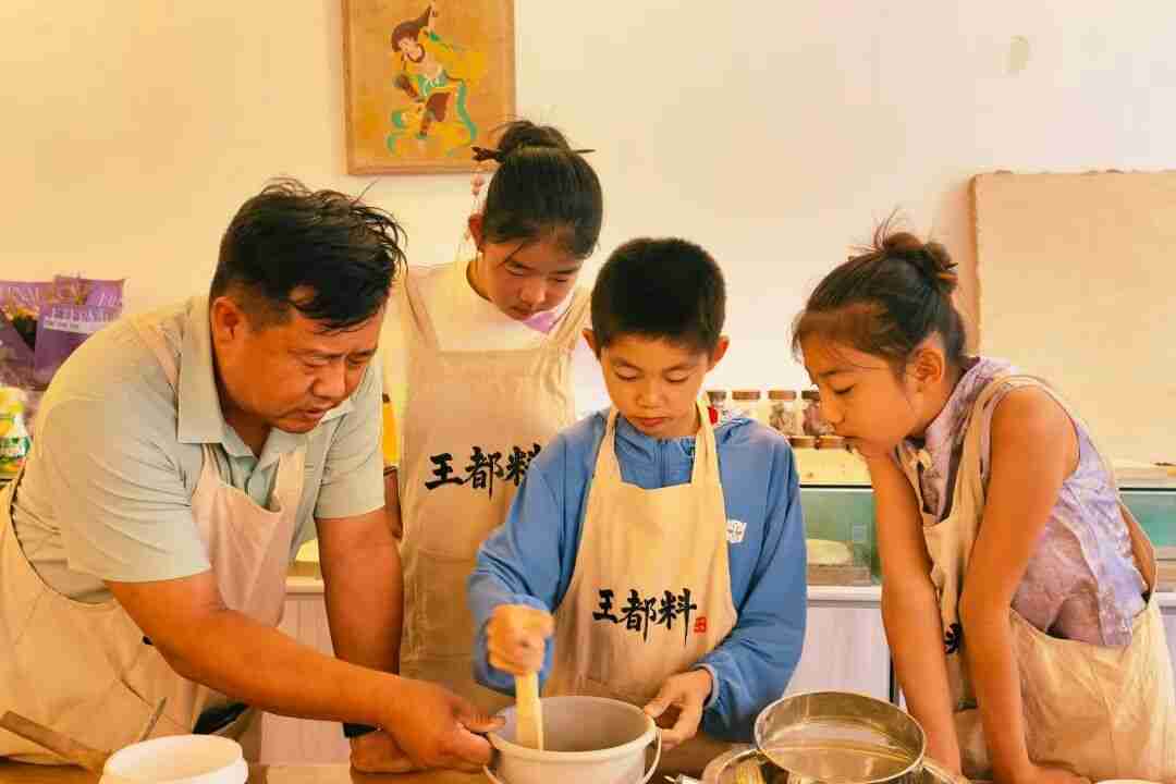 Sieving Dunhuang Chengbang soil into a fine, paste-like mud
