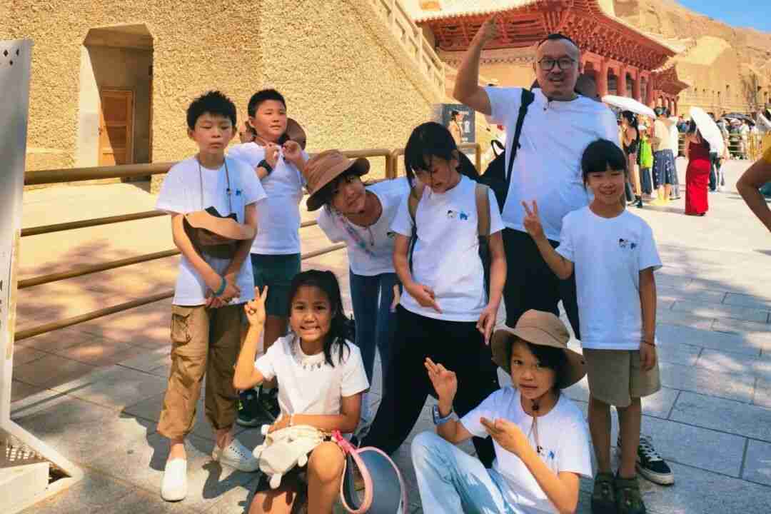 Children visiting the Mogao Caves grottoes